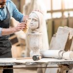 sculptor-working-with-sculpture-in-the-studio-Q5QUDLD.jpg